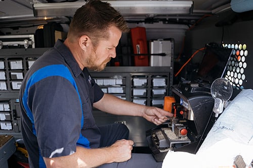 Key-cutting equipment being used inside our locksmith van